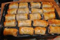 sausagerollsreadyfor2025christmassomeundercookedforheatinguplater_small.jpg